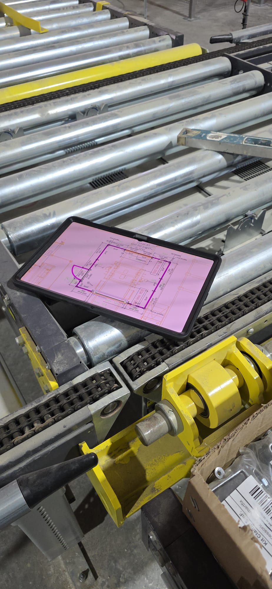 Technician reviewing a digital plant layout on a tablet